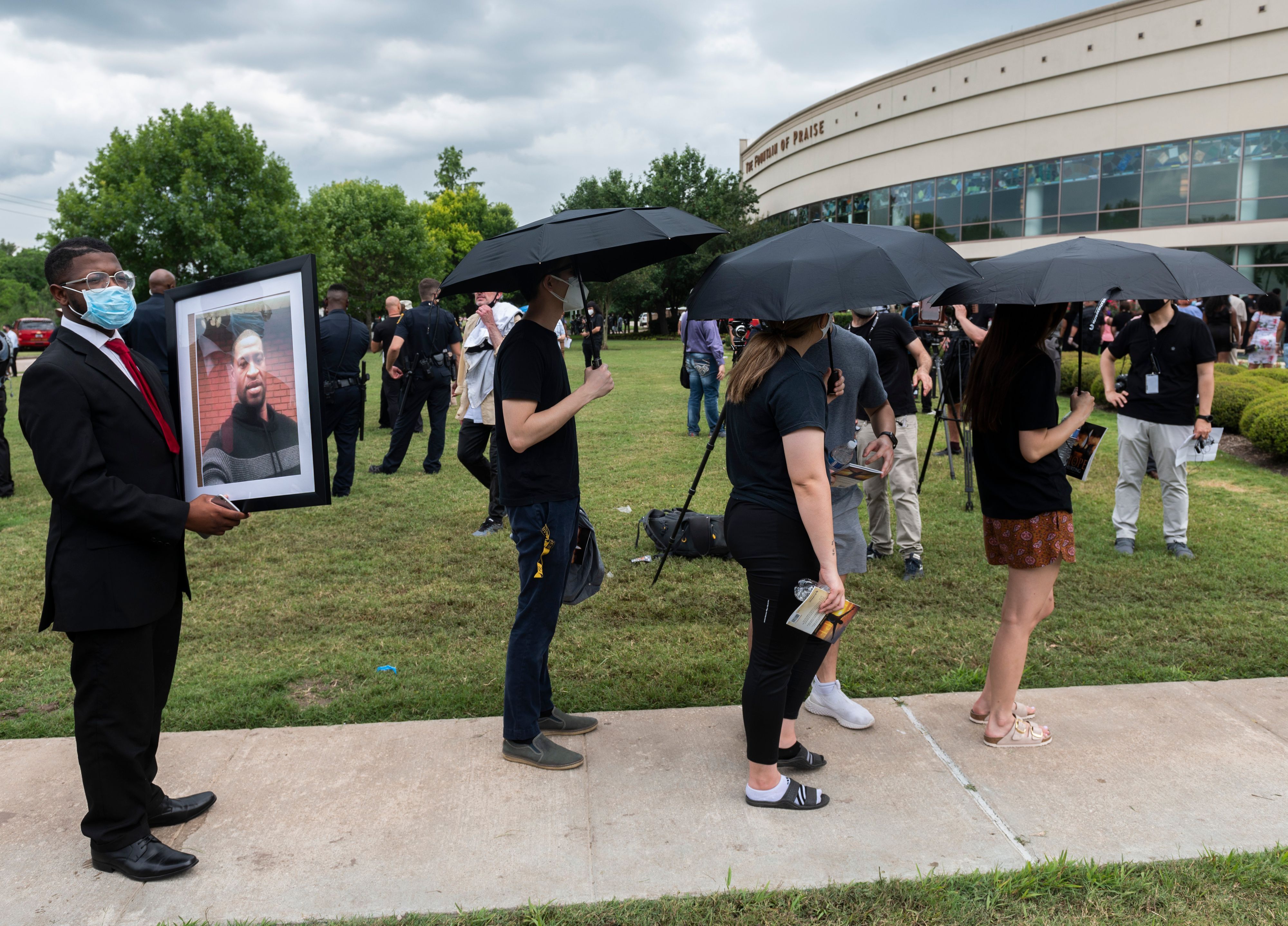 People wait in line to attend the public viewing for George Floyd at the Fountain of Praise church 1T383P.jpg