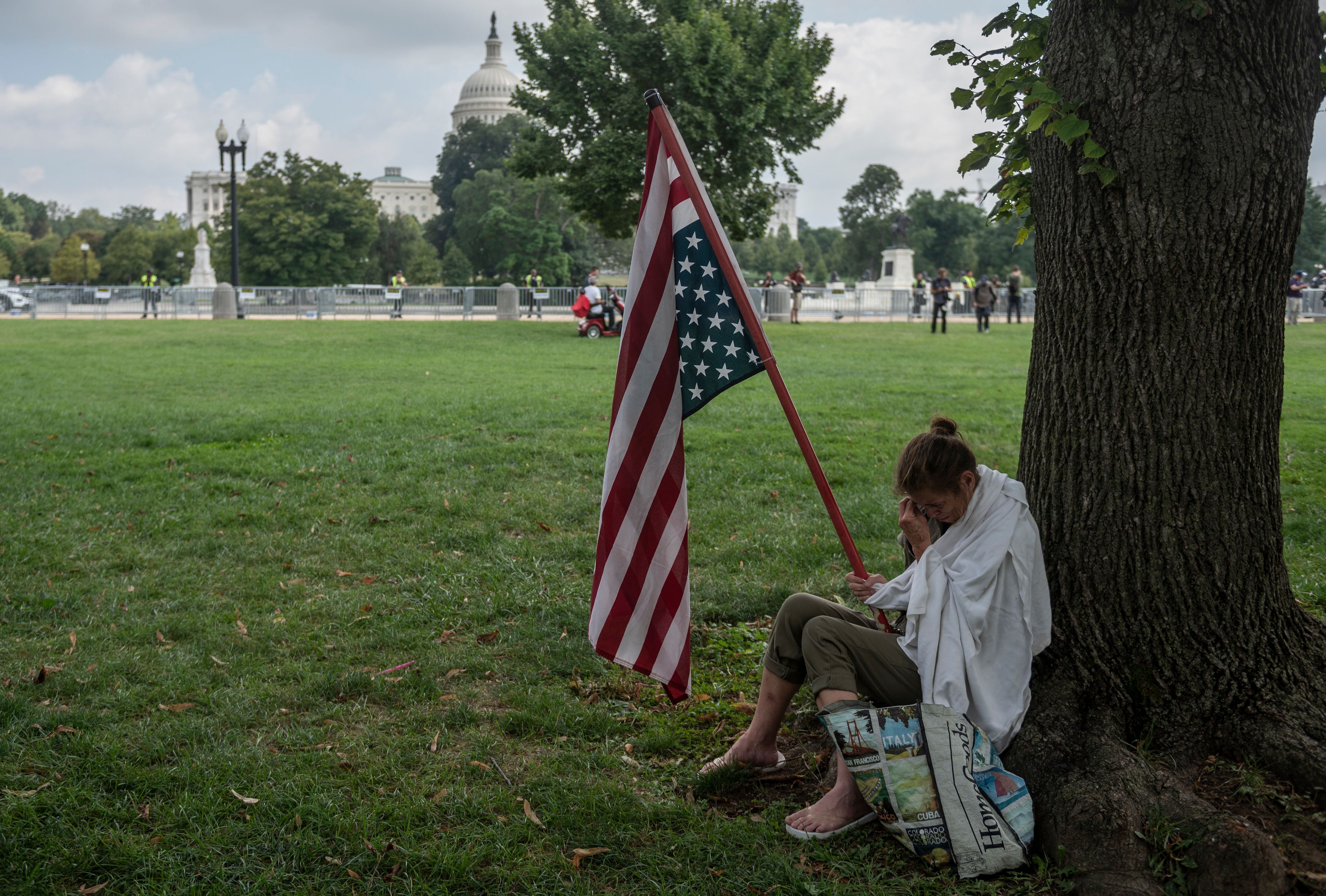 Geraldine Lovell from Maryland cries under a tree as she talks about the problems facing the United States as she takes part with demonstrators gathering for the "Justice for J6" rally in Washington, DC, on September 18, 2021, in support of the pro-Trump rioters who ransacked the US Capitol on January 6, 2021. 9N462C.jpg
