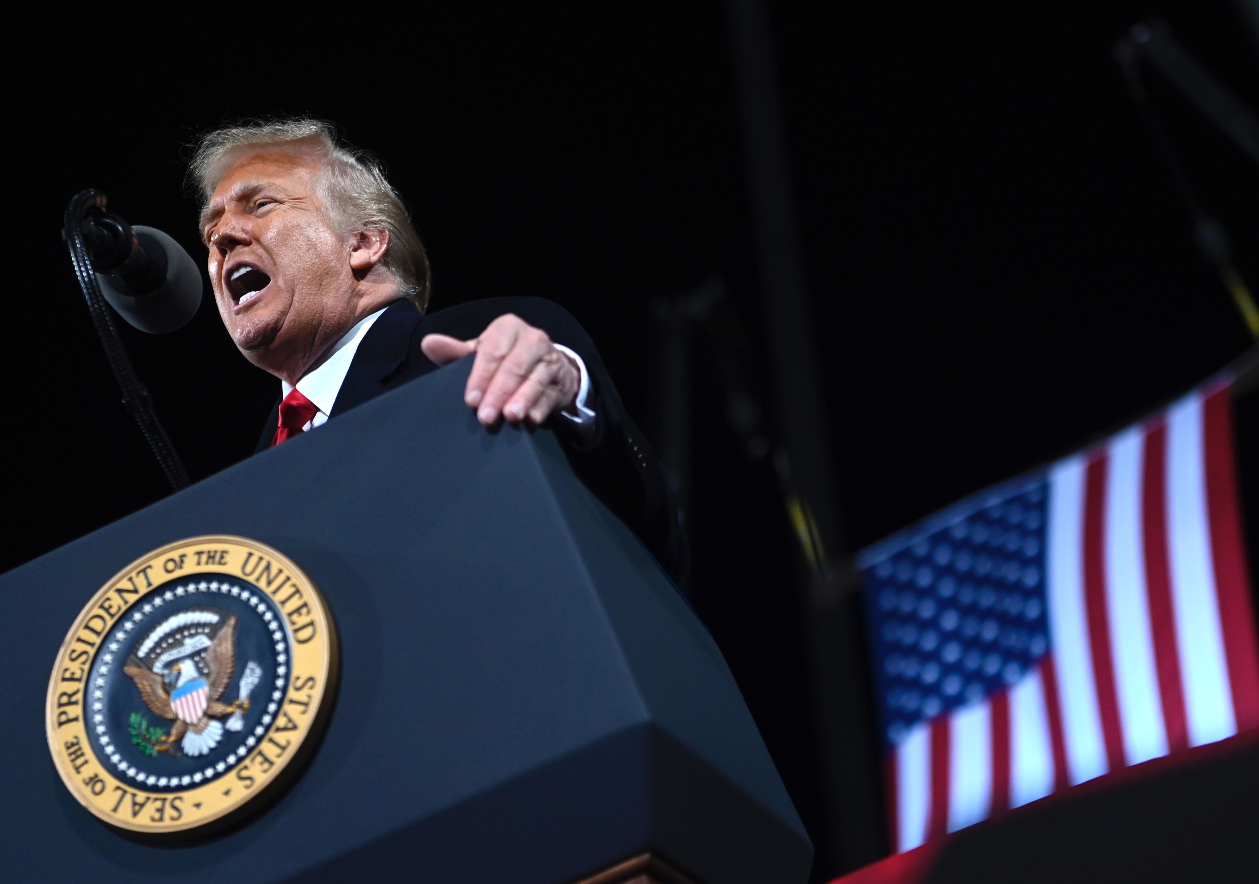 US President Donald Trump speaks during a rally to support Republican Senate candidates at Valdosta Regional Airport in Valdosta, Georgia 8WK3XM.jpg