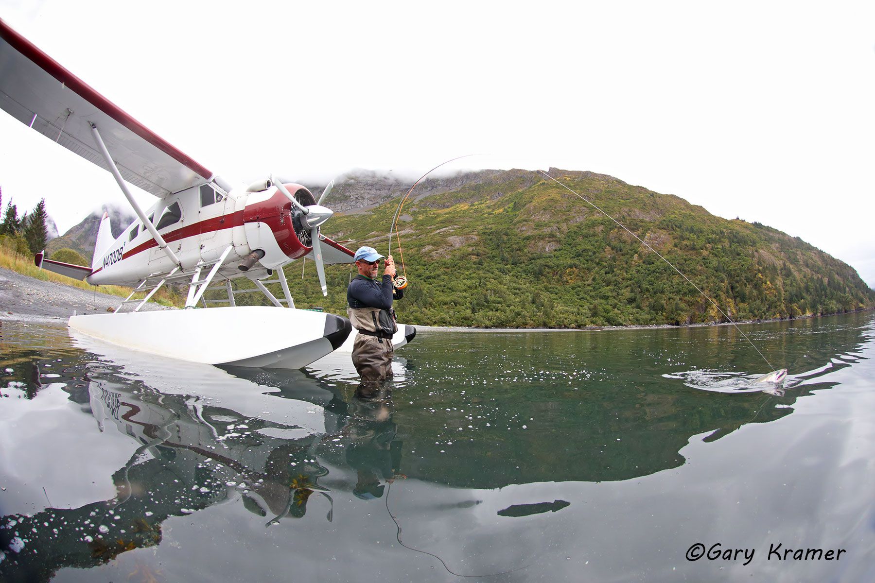 Flyfisherman fighting Silver Salmon near float plane - NFASfp#014d