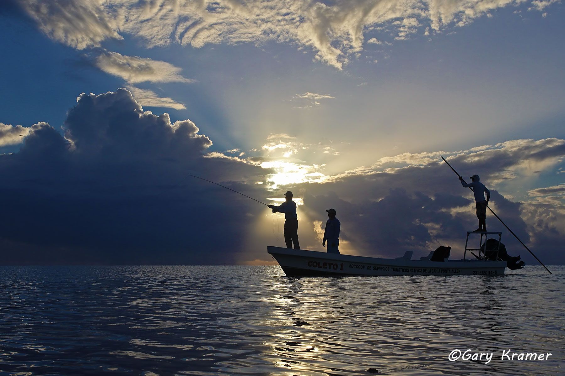 Flyfisherman/guide fishing from boat at sunrise/sunset, Mexico - NFFsg#244d