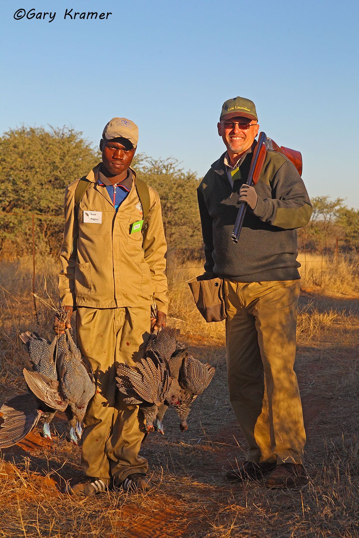 Hunter(s) (Scott Riggins) bird boy(s) w/Guineafowl, Africa Hunter(s) (Scott Riggins) bird boy(s) w/Guineafowl, Africa - AHGh#107d.jpg
