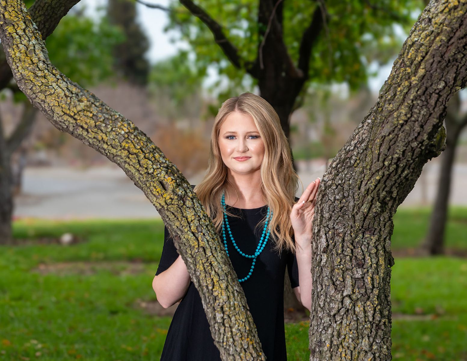 Model posing in between two trees