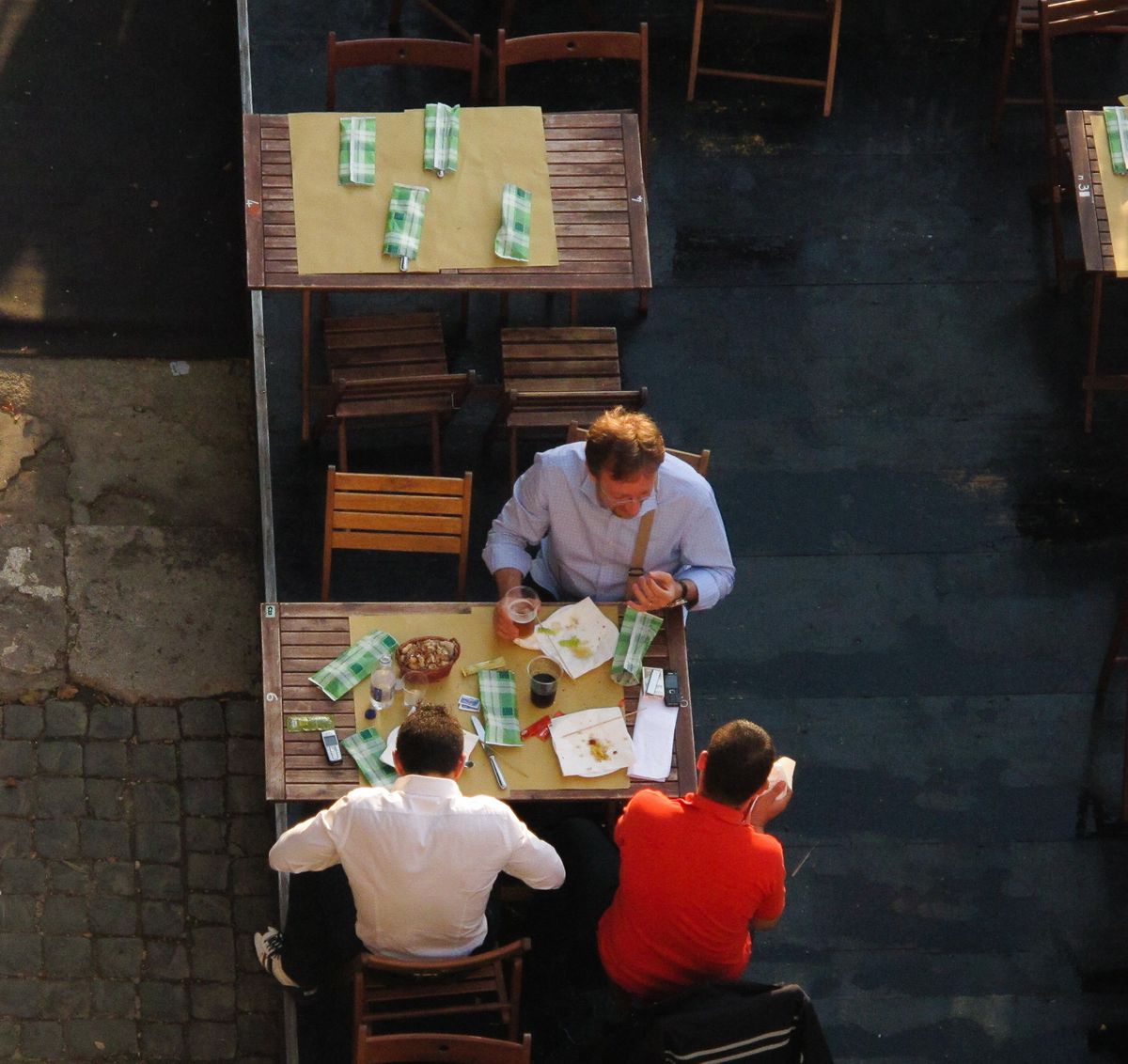 Three Italians having dinner.