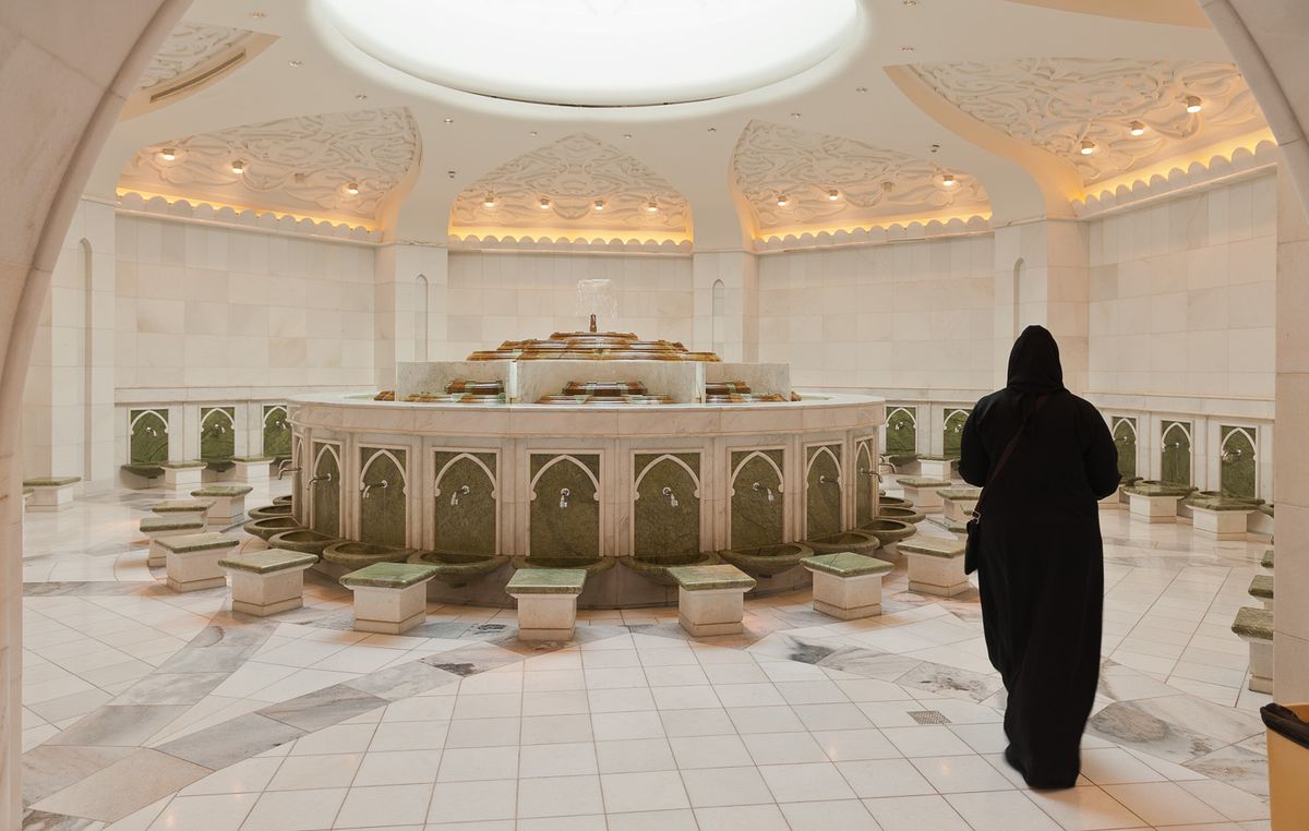 Muslim woman getting ready to perform ablution.