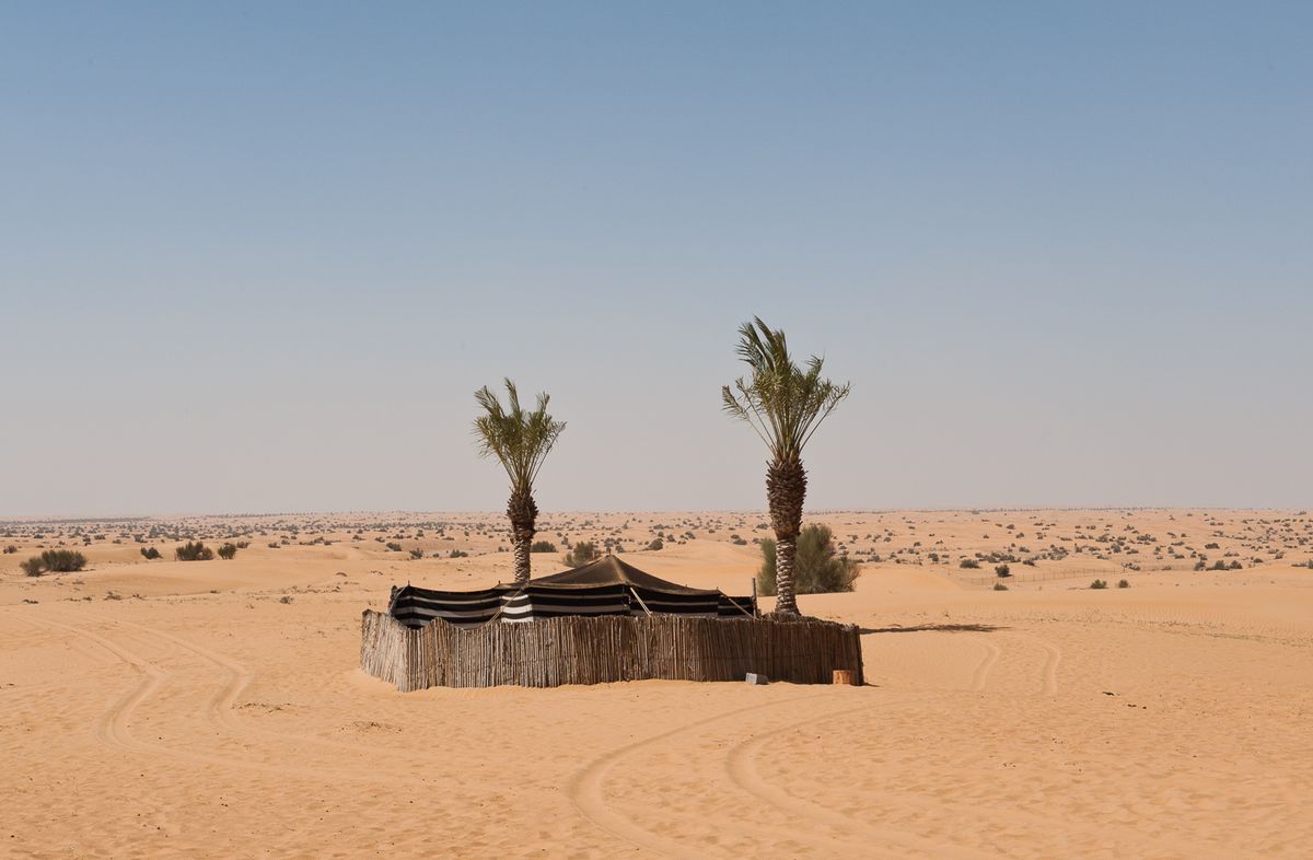 Bedouin tent in desert.