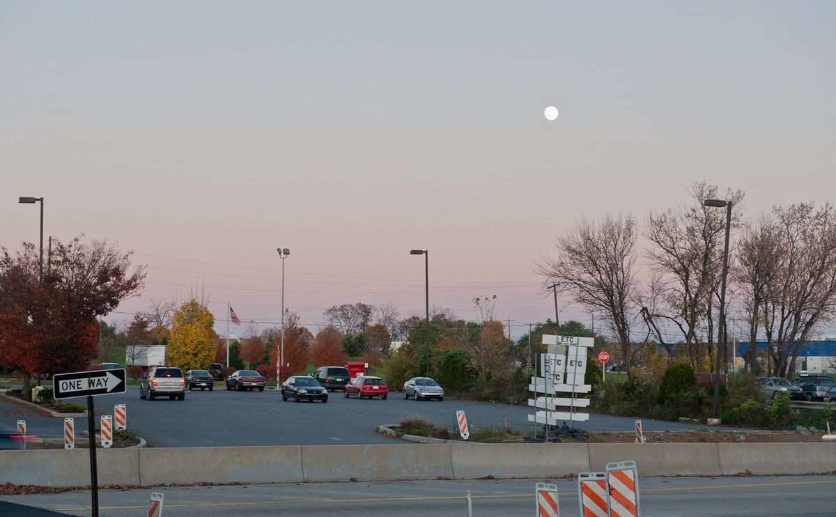 Moon across from gas station, off highway,