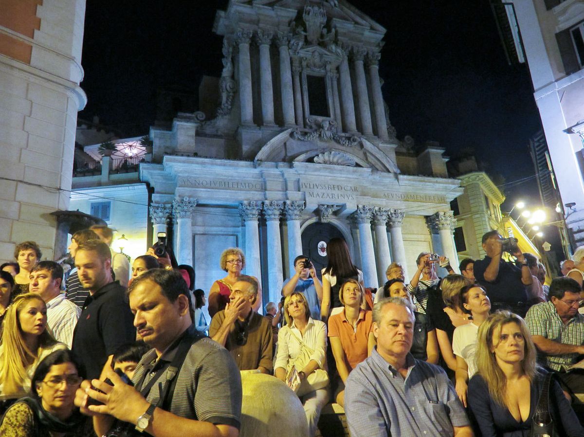 Tourists at night.