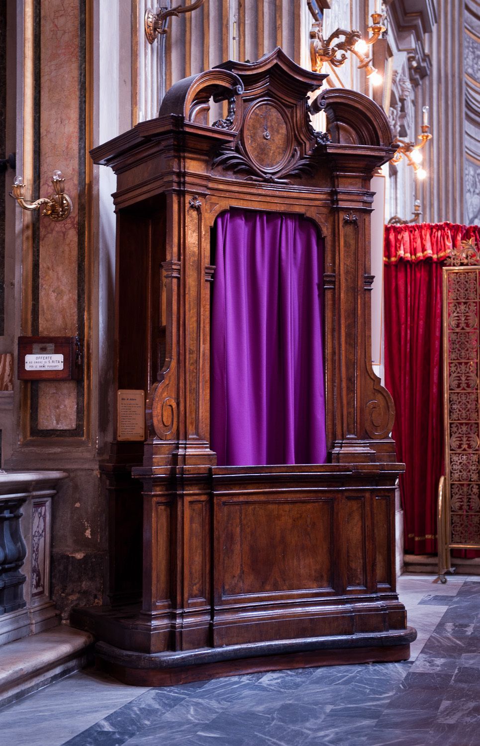 Confessional in Roman church.