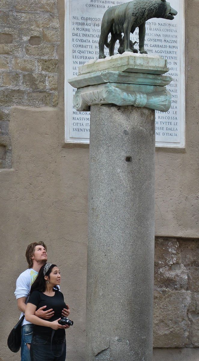 "Breast" man looking at statue with girlfriend.