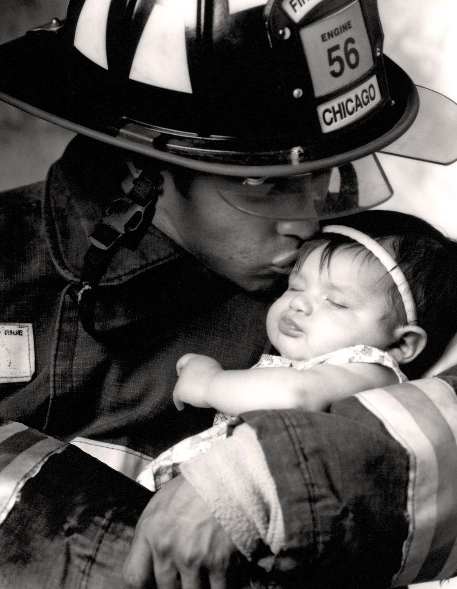 Red 35Chicago Fire Department fire fighter Jesse Estrada Jr. with his daughter Jenavive