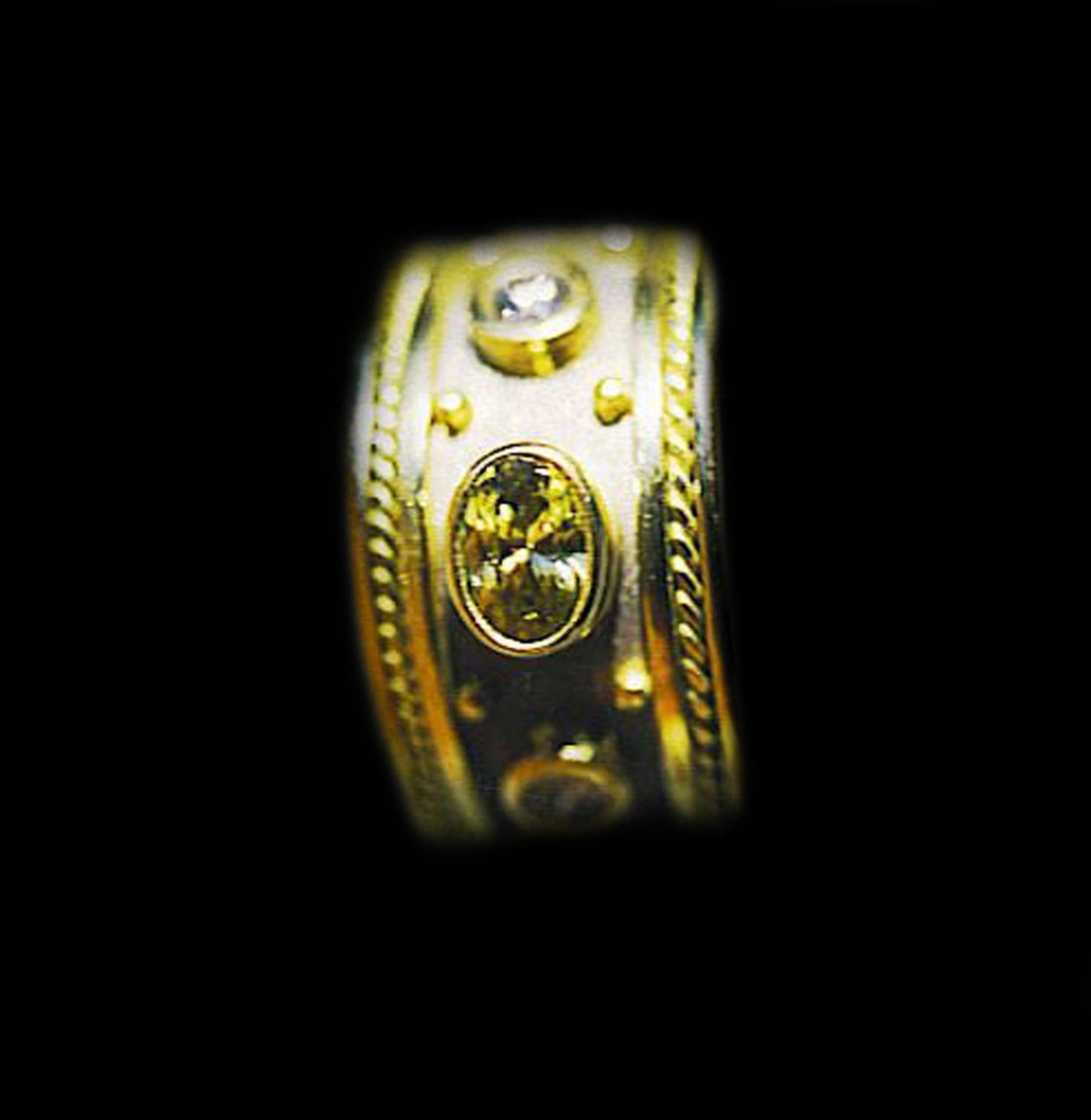 Canary dia. 2 ct. Ring with .50 side dia. set in 18 kt. wht. and yel. Gold