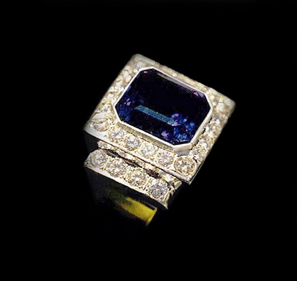 Tanzanite 8 ct. Ring set with 26 @ .10 dia. in Platinum and 18 kt. yel. Gold