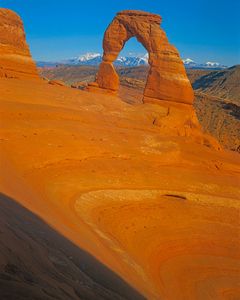 Delicate Arch With La Sal Mountains In The Distance, Arches National Park, Utah, 1980.