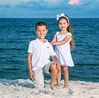 Brother and sister posing for beach picture
