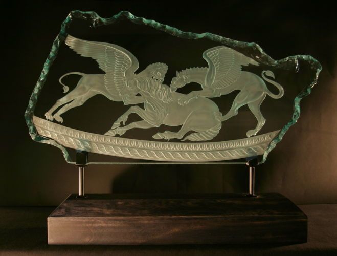  Griffins and horses, carved in glass Sold