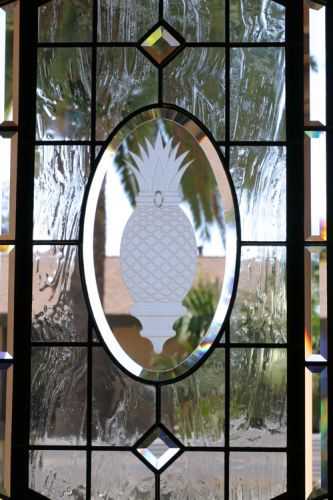 Carved glass of a Pineapple to look like jewelery in a door.Private residence - Corona Del Mar, CA