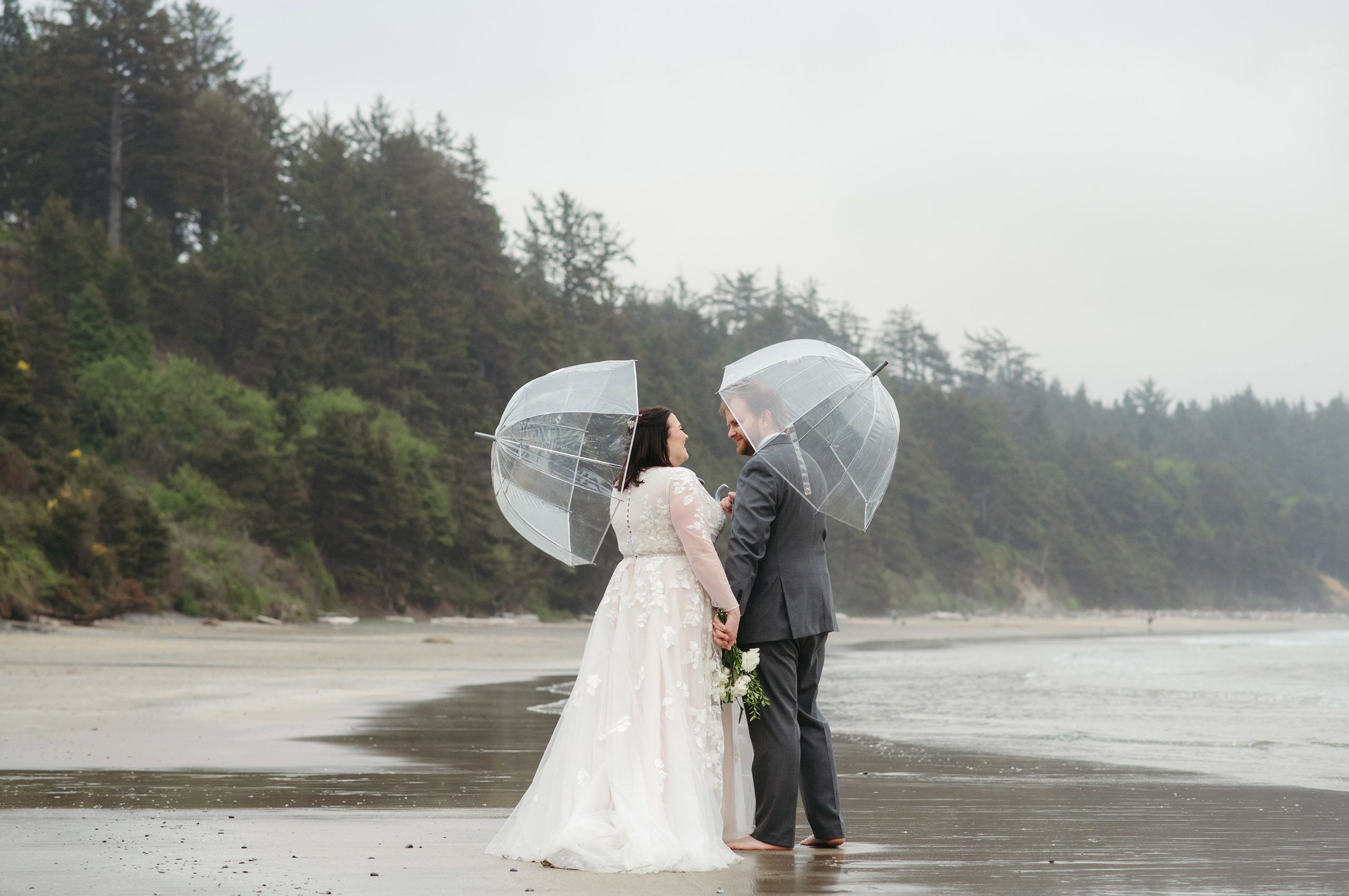 Rainy day wedding portraits at the beach