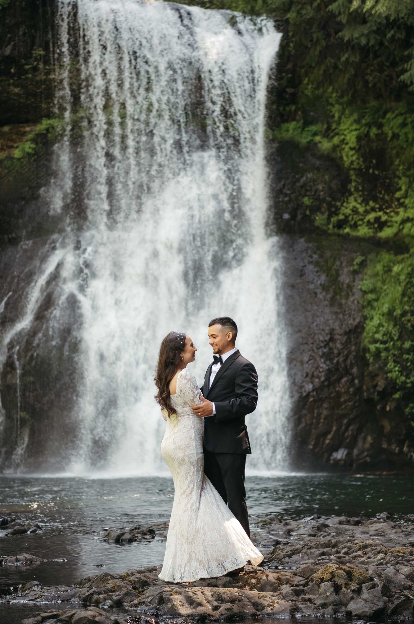 Bride and groom waterfall portrait
