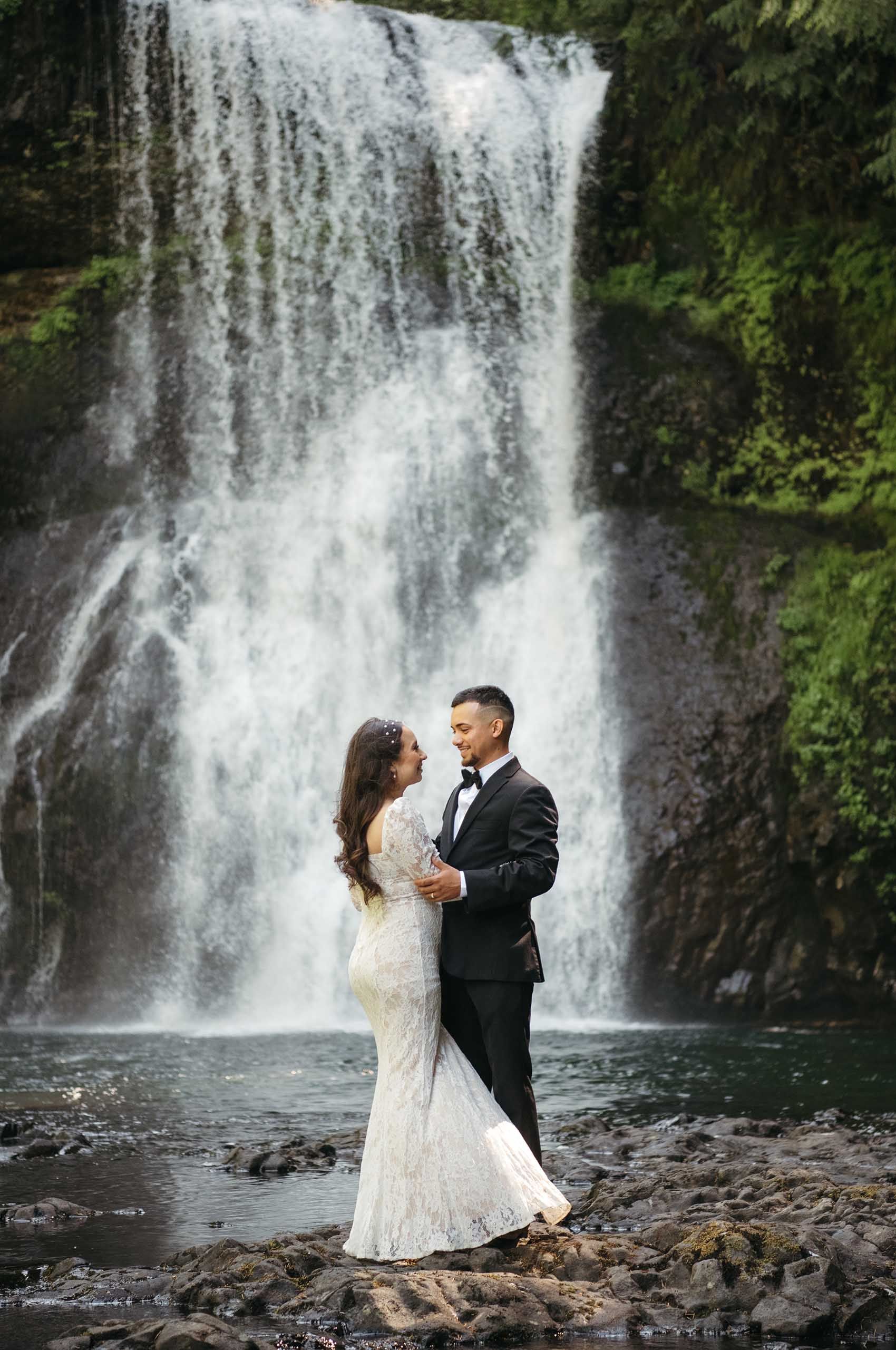 Bride and groom waterfall portrait