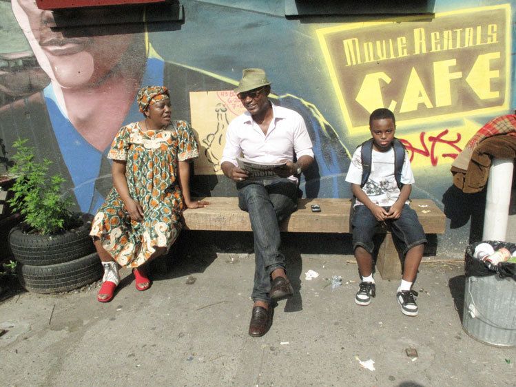 Actors on the bench of The Archive cafe.