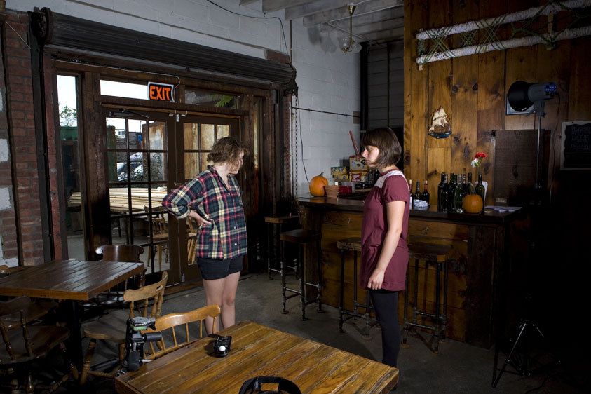 Emma and Nikki testing the lights on a photo shoot.