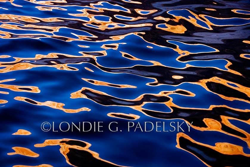 Blue, gold, brown, and black water reflection.        ©Londie G. Padelsky  LP31_5767_LondieGPadelsky