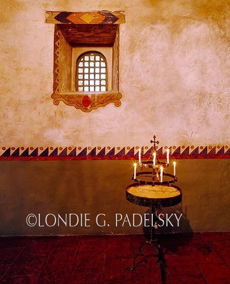 Painted walls and candles in the Historic California Mission ©Londie G. Padelsky CCM-400_LondieGPadelsky