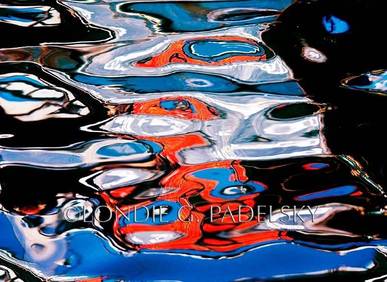 Orange, blue, black and white colored water reflection and abstract design. ©Londie G. Padelsky MB01_8621_LondieGPadelsky
