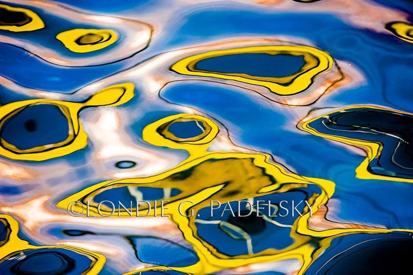 Yellow, blue, black and white water reflection and abstract design.   ©Londie G. Padelsky CBC_2927_LondieGPadelsky
