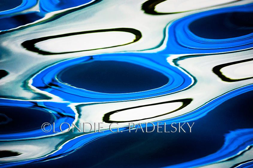 Blue, dark blue, black, and white water reflection and abstract design.      ©Londie G. Padelsky CBC_2771_LondieGPadelsky