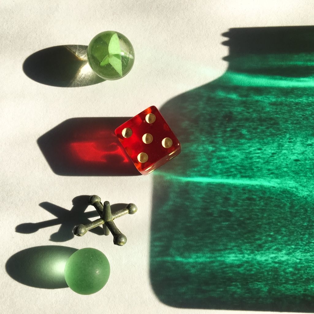 marbles, dice, green bottle