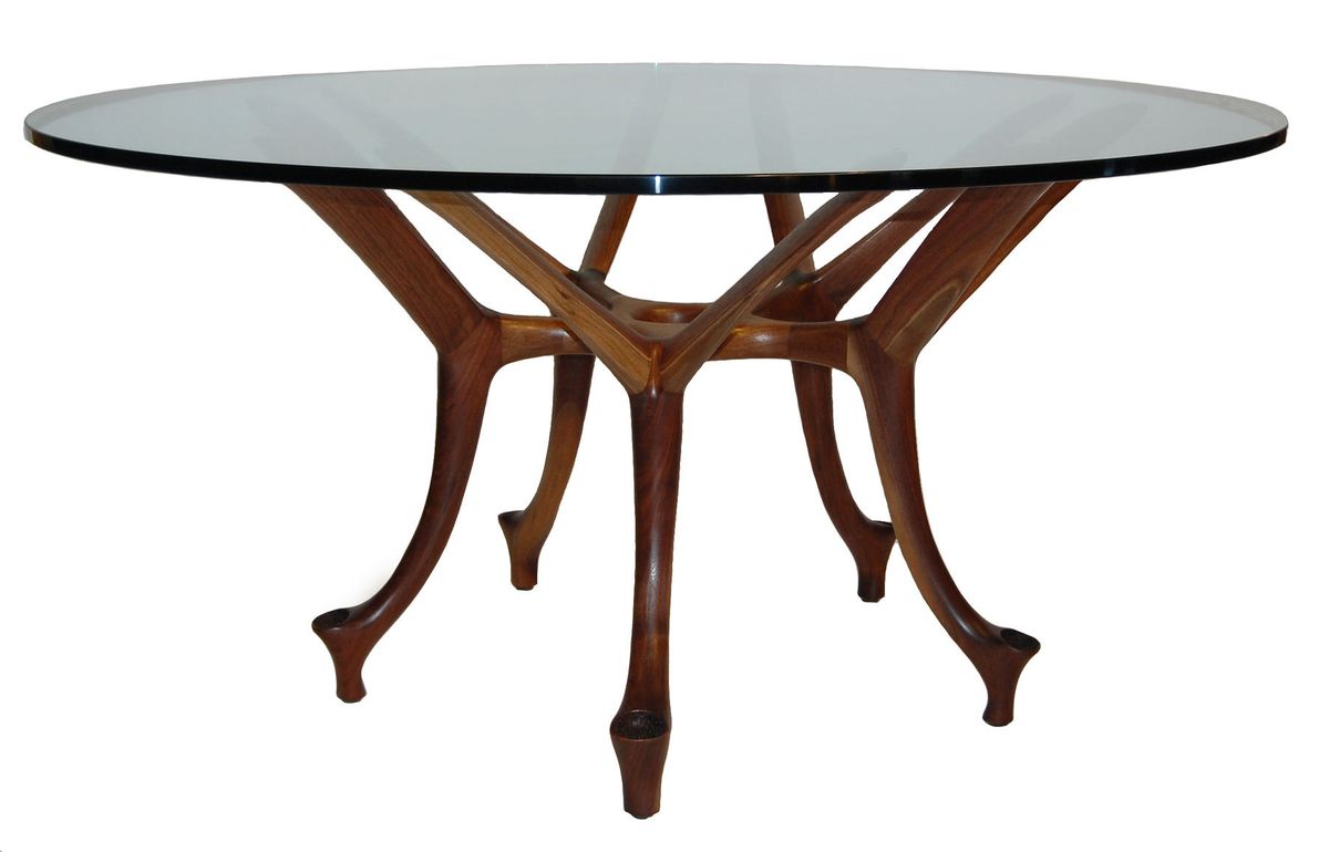 Shown with 60" diameter glass top and walnut base.  Available in a wide array of woods and custom sizes. Malabar table