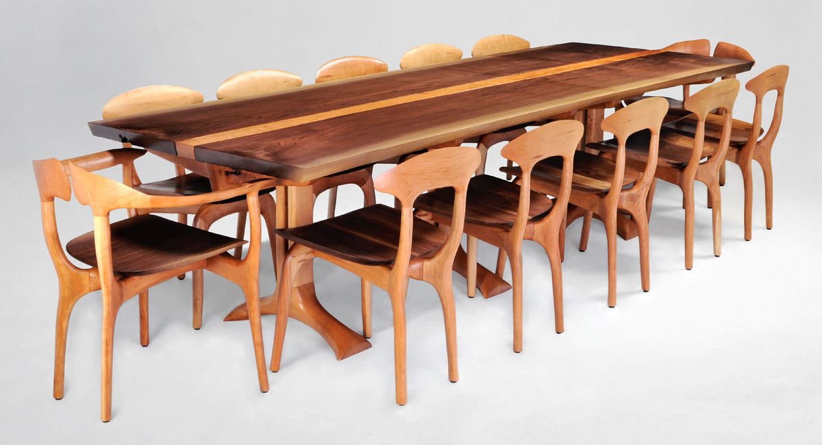 Shown are Sanctuary table and Sanctuary pedestal table with book-matched walnut top and cherry base.  Accompanied by matching Gentian chairs and Swallowtail chairs.  The walnut slabs run continuously across both table tops.  120" long x 38" wide x 30" high. Sanctuary table