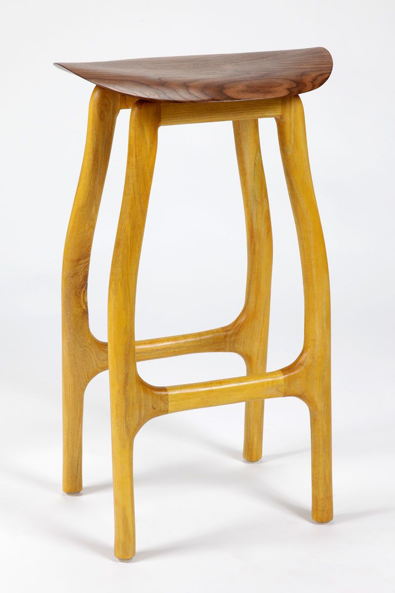 Shown with a limed ash base with golden yellow stain.  Walnut seat.  30"h x 18"w x 15"d.  Available in a wide array of woods and finishes. Mimosa stool