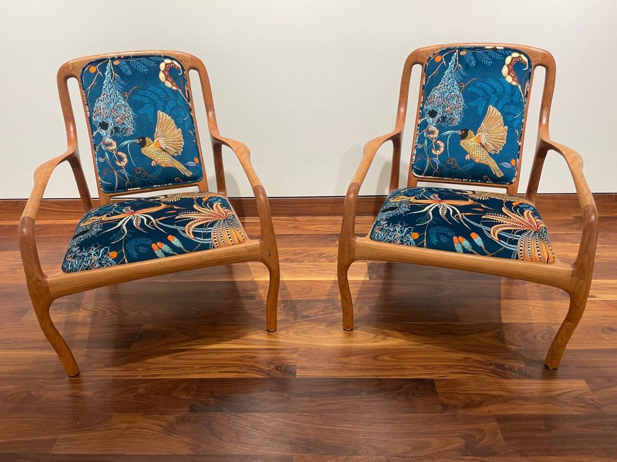 Shown with curly cherry frame and pattern velvet upholstery. Karnali lounge chair