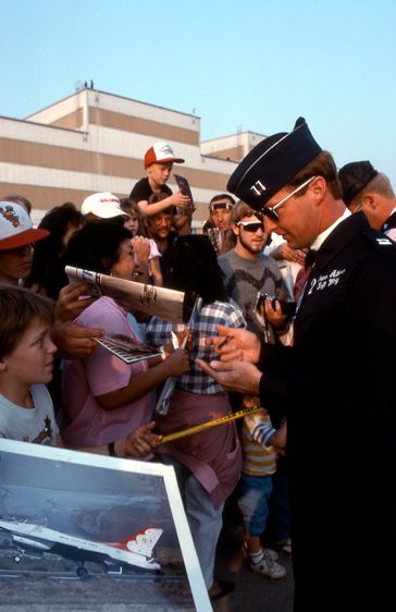 USAF Thunderbirds, F-16 Fighting Falcon pilot Dana Atkins signs autograph after flight, Norton AFB, CA