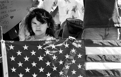 Child with flag at troop support rally, San Diego, CA