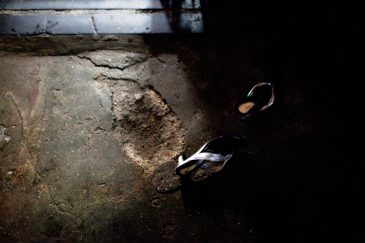 Girl’s shoes lay abandoned outside a brothel entrance.© Hazel Thompson Mumbai's Gangsters & Sex Slaves