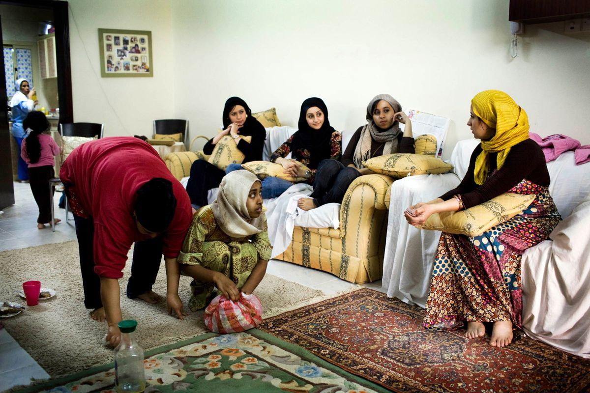 Sima, a fashion designer aged 35 years at her home with her family in Bahrain.© Hazel Thompson Measure of a Woman