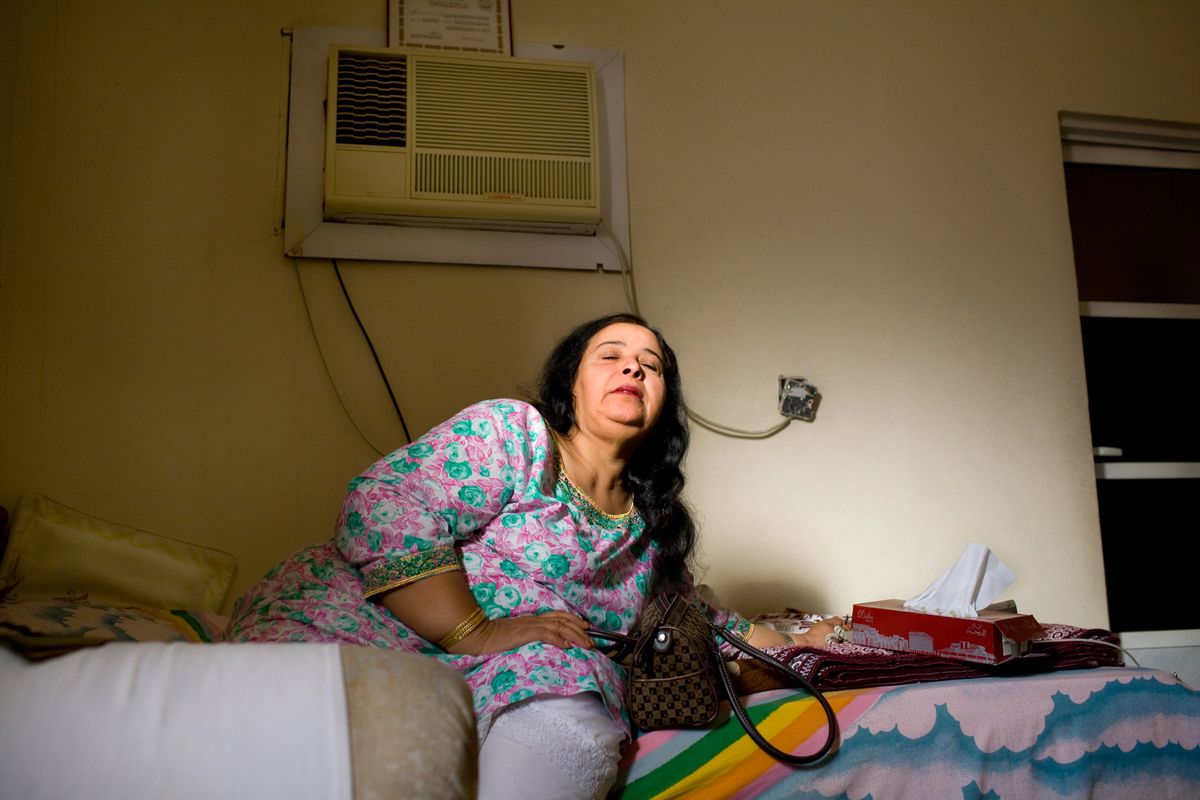 Ghazowa, aged 55 years, in her bedroom in Doha, Qatar© Hazel Thompson Measure of a Woman