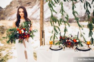 Romantic_Winter_Shoot_Bride_with_Colorful_Flowers_Backdrop.jpg