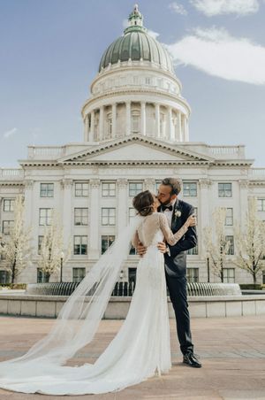 Bride and groom kiss after ring ceremony Couple