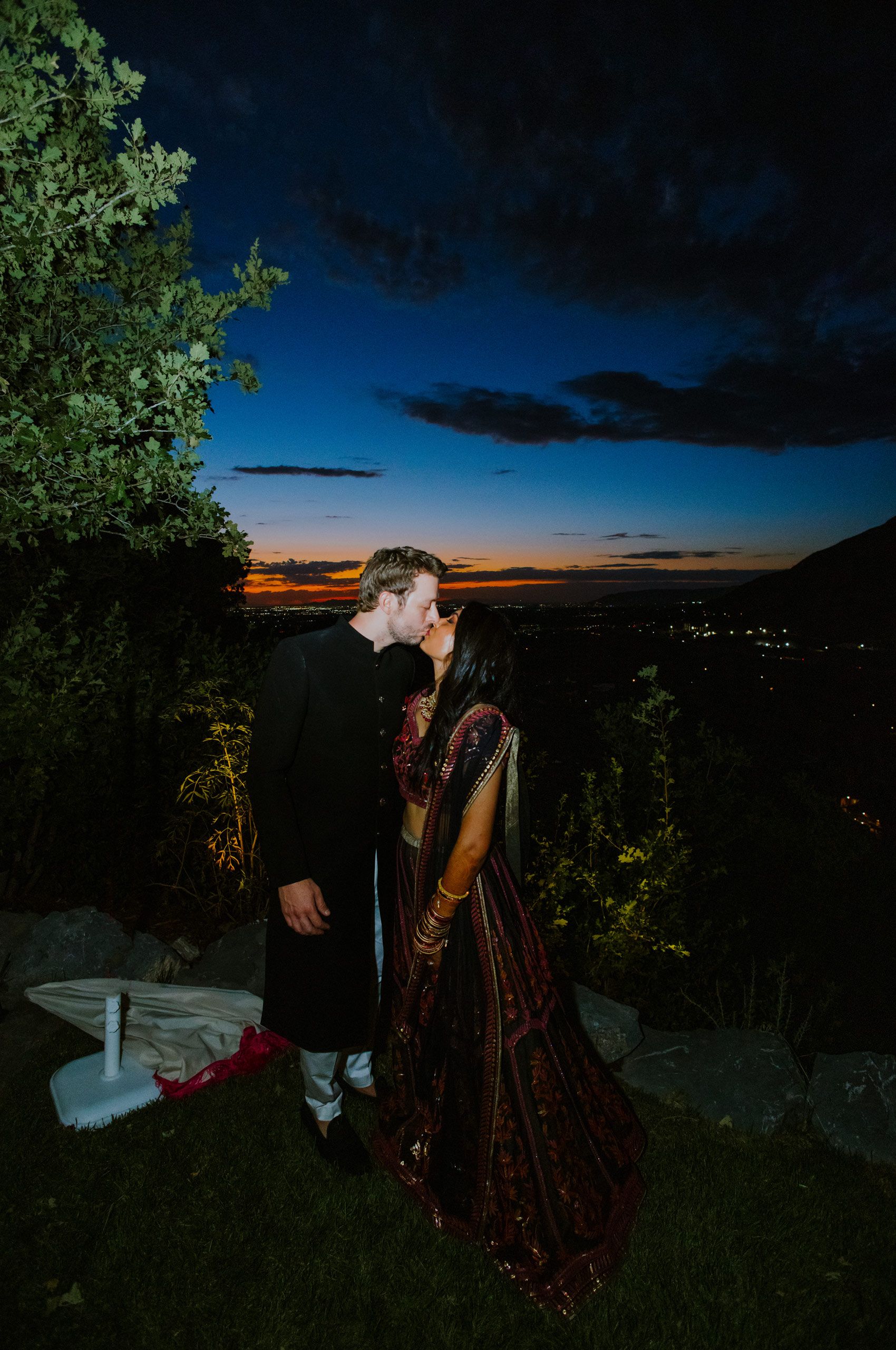 Bride and Groom Kissing at Sunset Haldi