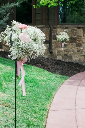 Hoopes Events | Katelyn and David | Park City Utah | Entranceway Lined with Shepherd's Hooks and Adorned with Baby Breath and Pink Carnations Katelyn_David_Park_City_Utah_Baby_Breath_Pink_Carnation_Entranceway.jpg