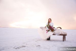 Salt_Air_Wedding_Shoot_Saltair_Resort_Salt_Lake_City_Utah_Sun_Shining_Through_Clouds_Bride_Sitting_on_Fainting_Couch.jpg