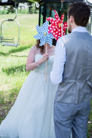 Hoopes Events | Ashley and Dan | Solitude Resort | Solitude Utah | First Look | Couple Holding Pinwheels Over Face Ashley_Dan_Solitude_Resort_Solitude_Utah_Couple_Pinwheel_First_Look.jpg