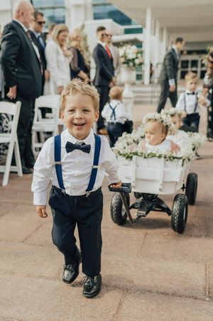Ring Bearer Pulling Flower Girls in Wagon Ceremony