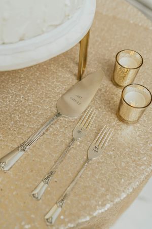 Cake forks and server on sequin gold tablecloth Reception Details