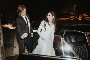 Bride and Groom Getting Into Vintage Car Sendoff